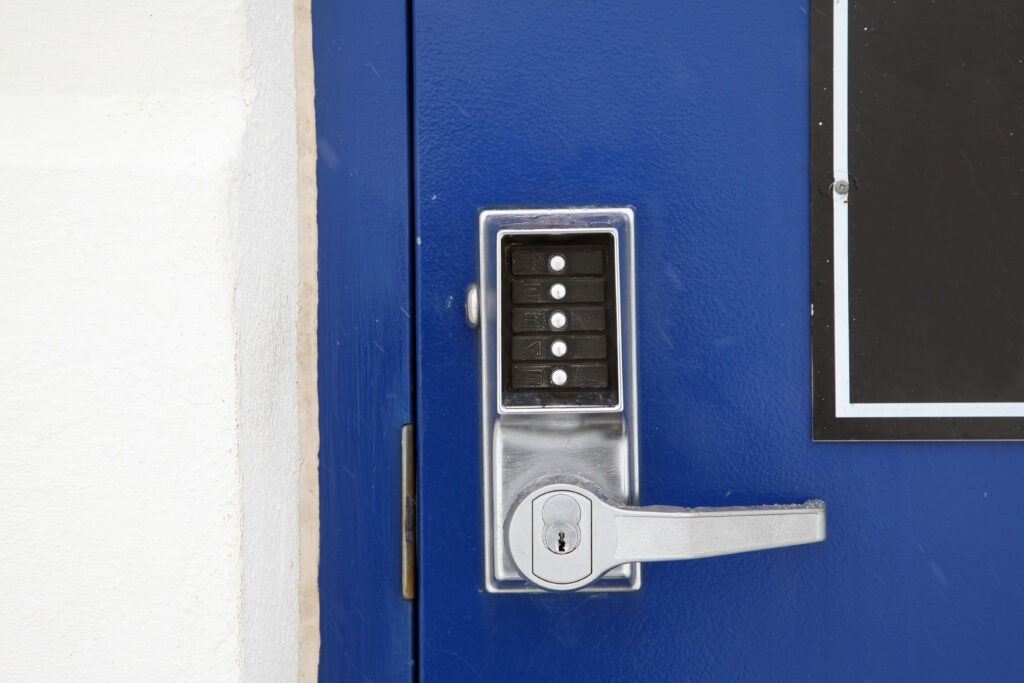 Close-up of door with security alarm code
